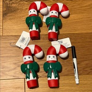Set of four candy cane dog squeaker toys